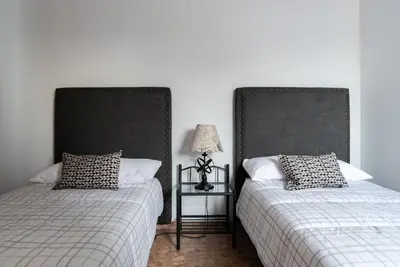 two beds sitting next to each other in a bedroom at Magnifico apartamento en Burriana in Burriana