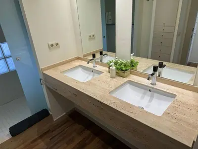 a bathroom with two sinks and a large mirror at Spacious Apartment in Valencia with Sea View - 160 sqm in Valencia