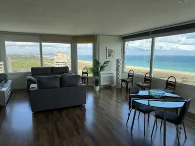 a living room with a couch and a table with chairs at Spacious Apartment in Valencia with Sea View - 160 sqm in Valencia