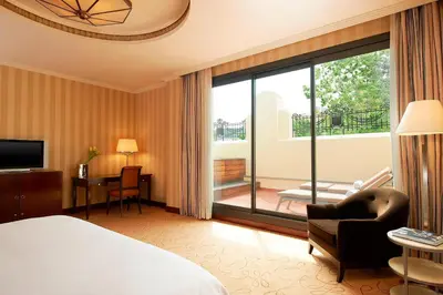 a hotel room with a bed and a balcony at The Westin Valencia in Valencia