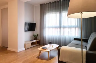 a living room with a couch and a table at Valenciaflats Ciudad de las Ciencias in Valencia