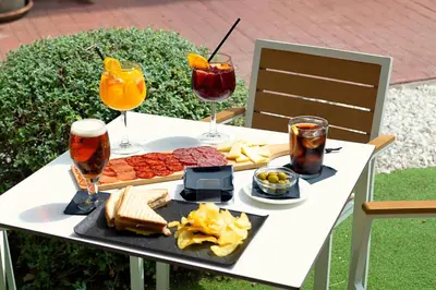 a table with a tray of food and drinks at DWO Valencia in Valencia