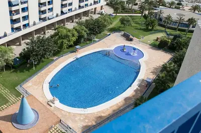 an overhead view of a swimming pool in a building at ApartUP Patacona Oriental in Valencia