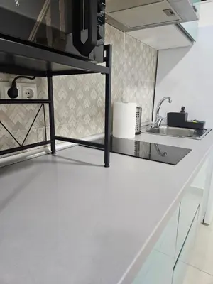 a kitchen with a white counter and a sink at Alojame Valencia in Valencia