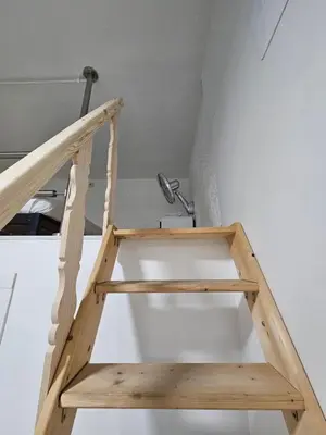 a ladder in the corner of a room at Alojame Valencia in Valencia