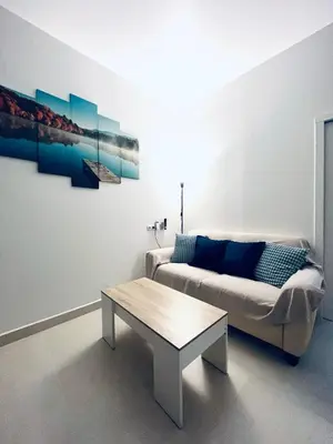 a living room with a couch and a coffee table at Alojame Valencia in Valencia