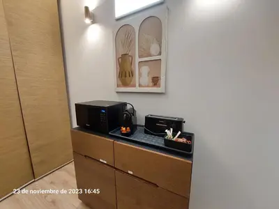 a microwave sitting on top of a counter in a room at Ruzafa in love in Valencia