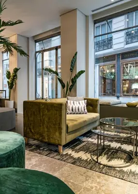 a living room with a couch and a table at Vincci Palace in Valencia