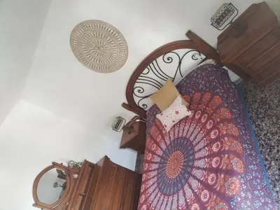 a bedroom with a bed and a dresser at Apartamento en Serra con preciosas vistas. in Serra