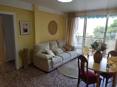 a living room with a couch and a table at Apartamento en Serra con preciosas vistas. in Serra