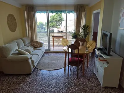 a living room with a couch and a table at Apartamento en Serra con preciosas vistas. in Serra