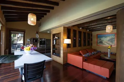 a living room with a couch and a table at Villa Huerta 2, Paterna, jacuzzi, sauna in Paterna