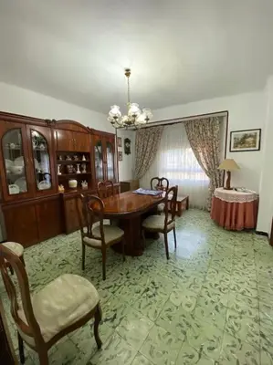 a dining room with a table and chairs at Casa en Puerto de Sagunto. Playa in Canet de Berenguer