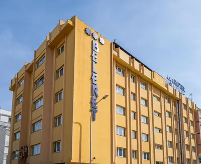 a yellow building with a sign on it at Hotel Beleret in Valencia