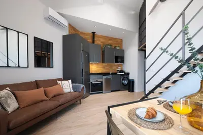 a living room with a couch and a table at Loft con carácter en Valencia. in Valencia