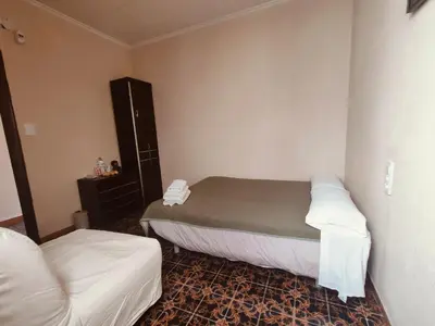a small room with a bed and a couch at Pensión Benavente AP-7 3min coche Playa 5 min Self check-in 24h in Moncófar