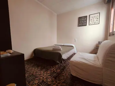 a room with a bed and a couch in it at Pensión Benavente AP-7 3min coche Playa 5 min Self check-in 24h in Moncófar