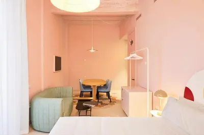 a room with a table and chairs and a bed at Casa Clarita in Valencia