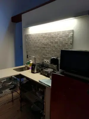 a kitchen with a sink and a counter top with a stove at TYNE ARTIS HOUSE in Valencia