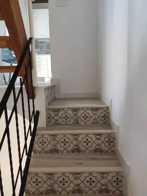 a set of stairs with tiles on the wall at Barcabanyal in Valencia