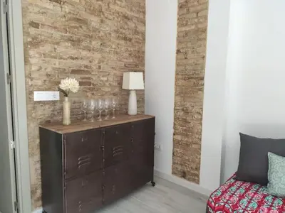 a bedroom with a dresser with glasses on it at Barcabanyal in Valencia