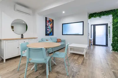 a kitchen with a counter top with a sink and tiles at ApartUP Ruzafa Vertical in Valencia