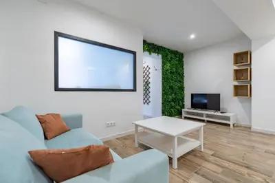 a city street with buildings and a clock tower at ApartUP Ruzafa Vertical in Valencia