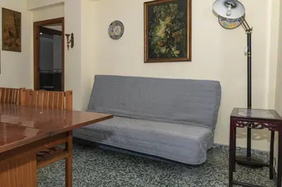 a living room with a couch and a table at Levante, 6-J in Cullera