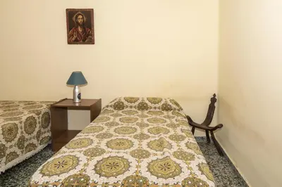 a bedroom with a bed and a table with a picture on the wall at Levante, 6-J in Cullera