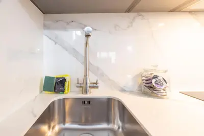 a kitchen sink with a faucet on a counter at FLORIT FLATS - The Apolo Studio in Valencia