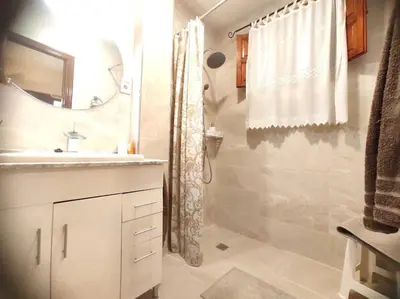 a bathroom with a sink and a shower at Encantadora casa de pueblo in Sagunto