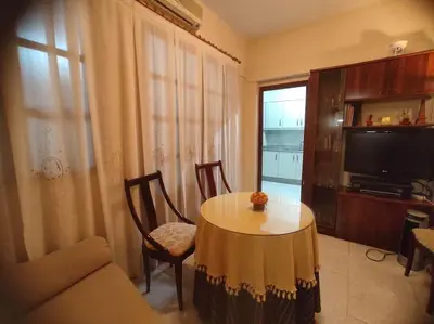 a living room with a table and a tv at Encantadora casa de pueblo in Sagunto