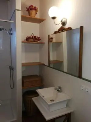 a bathroom with a sink and a mirror at Casa La Higuera in Chulilla