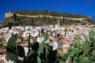 a town on top of a hill with white buildings at Casa La Higuera in Chulilla