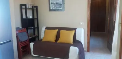 a bedroom with a bed with two yellow pillows at Playa Paradís - Primera linea de playa - AP-7 3min - Self check-in 24h in Moncófar