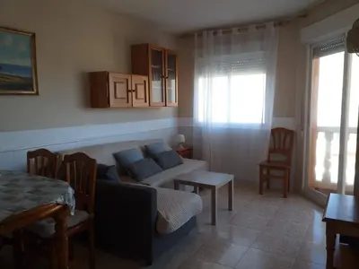 a living room with a couch and a table at Playa Paradís - Primera linea de playa - AP-7 3min - Self check-in 24h in Moncófar