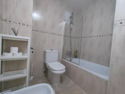 a bathroom with a toilet and a shower and a sink at Playa Paradís - Primera linea de playa - AP-7 3min - Self check-in 24h in Moncófar