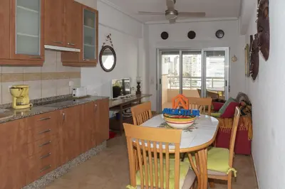 a kitchen and dining room with a table and chairs at Prado, A-5-52 PK INT 85 in Cullera