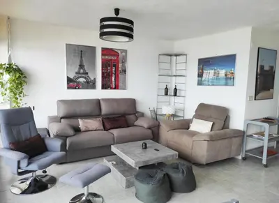a living room with a couch and a table at Terrace & Sea Views in Cullera in Faro de Cullera