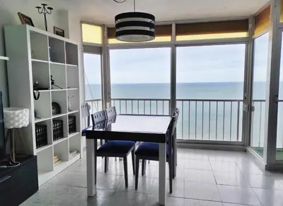 a dining room with a view of the ocean at Terrace & Sea Views in Cullera in Faro de Cullera