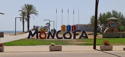 a playground with a sign that says monocasta at Apartamento Aguamarina - Playa Moncofa in Moncófar