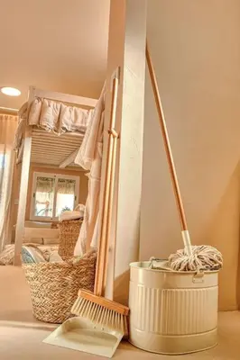 a room with a broom and a basket and a mirror at Suite con Jacuzzi en la montaña. in Llombay