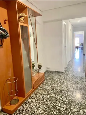 a room with a mirror and a dresser and a hallway at private room in shared apartment Valencia WorkStay in Valencia