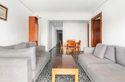 a living room with two couches and a table at private room in shared apartment Valencia WorkStay in Valencia