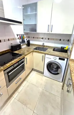 a kitchen with a washing machine and a sink at BEACH VALENCIA LUXURY B40-7 Apartament on Beach in Valencia