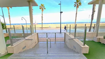 a stairway leading to a beach with palm trees at BEACH VALENCIA LUXURY B40-7 Apartament on Beach in Valencia
