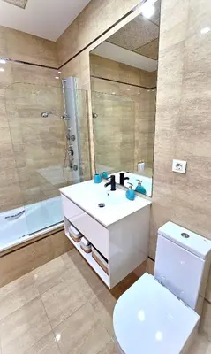 a bathroom with a sink and a shower and a toilet at BEACH VALENCIA LUXURY B40-7 Apartament on Beach in Valencia