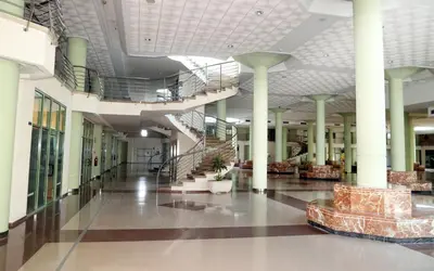 an empty lobby of a building with columns and stairs at Apartamento dos habitaciones primera línea de playa in Valencia
