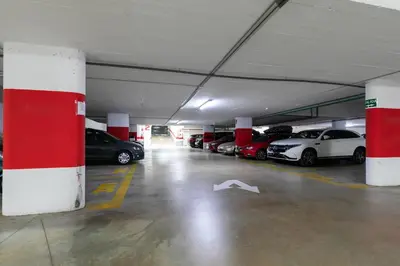 a parking garage with cars parked in it at Veramar Beach Apartment in Valencia
