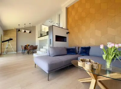 a living room with a couch and a table at Colina del Sol Penthouse Horizonte in Cullera